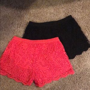 Coral and black lace shorts
